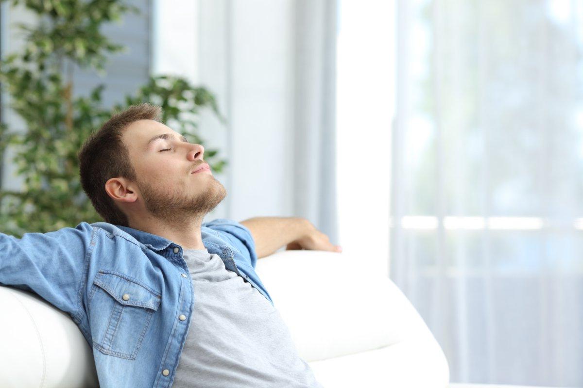 man breathing air inside home